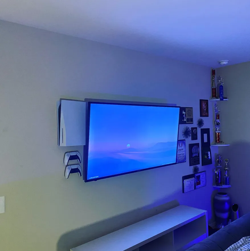 Gaming console setup with organized cables near a TV