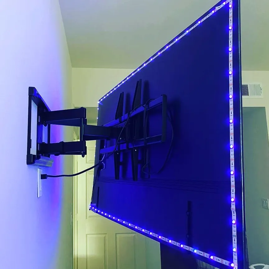 LED bias lighting installed behind a wall-mounted TV