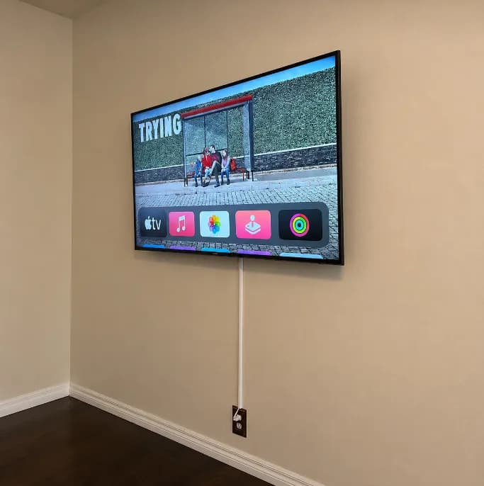 Plastic cable raceway installed along a wall