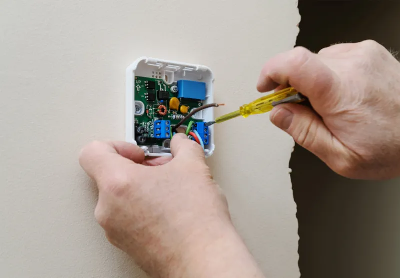 Smart thermostat installed on a wall