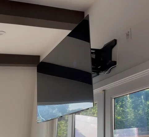 Motorized TV mount in a living room