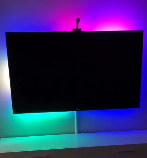 Smart LED lighting behind a media console