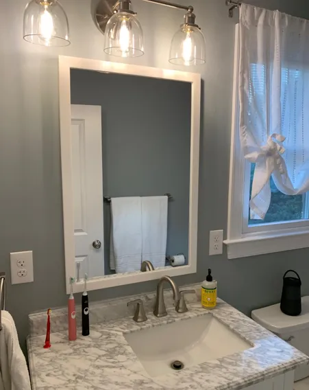 Heavy artwork hung on drywall with proper hardware