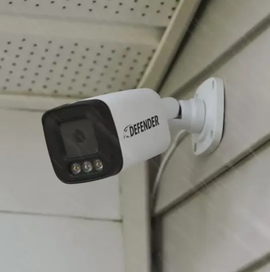 Outdoor security camera installation on a home