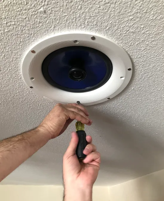 Flush in-ceiling speakers installed in a home theater