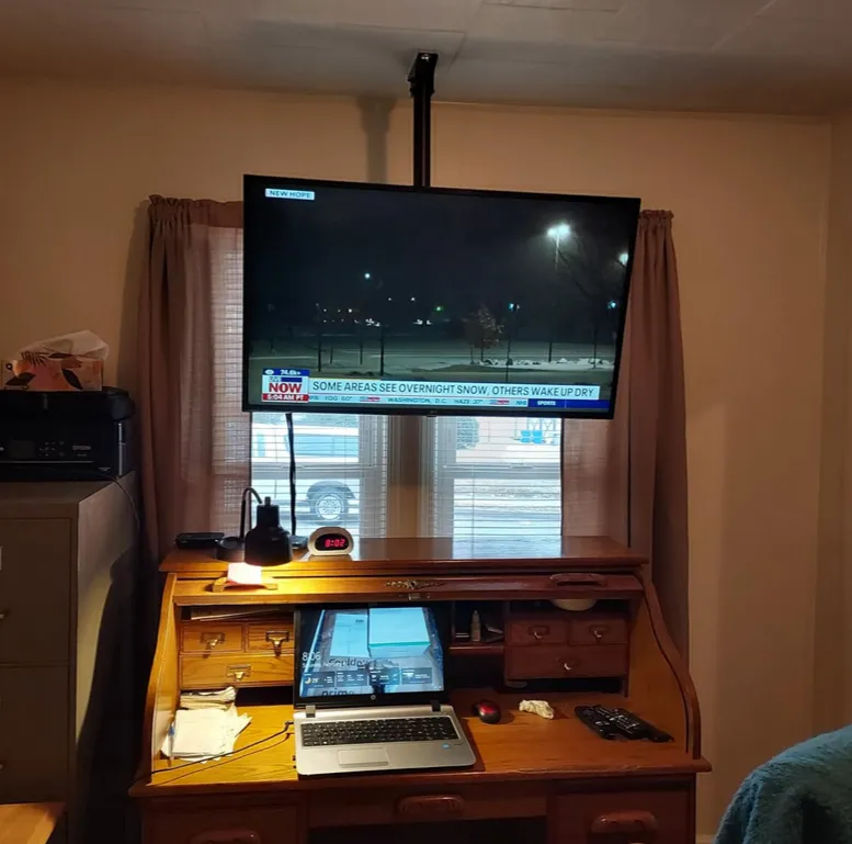 Ceiling mount with adjustable tilt in a gym