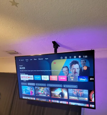 Ceiling-mounted TV with clean cable routing