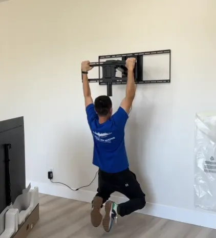 Retractable TV mount flush against the wall
