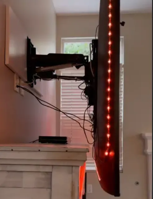 Premium motorized TV installation in a living room